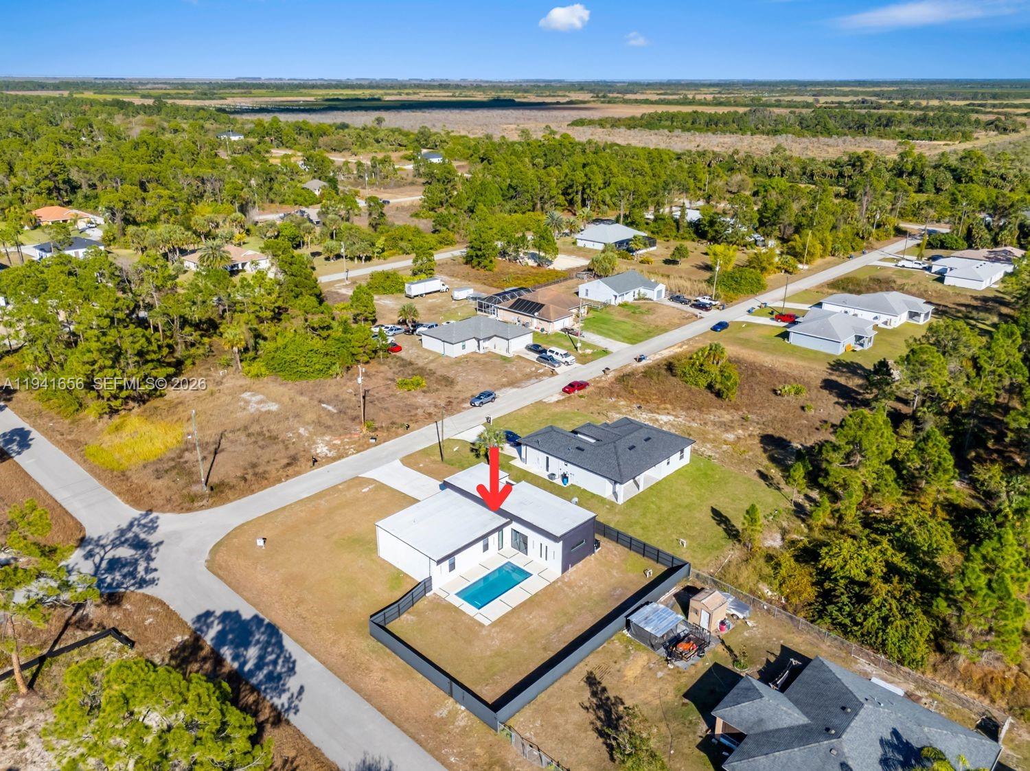 1236 East County Lehigh Acres, FL 33974 - Photo 43 of 44 an aerial view of residential houses with outdoor space