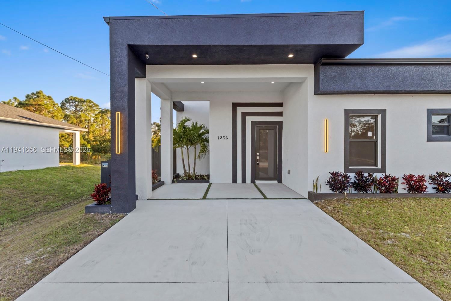 1236 East County Lehigh Acres, FL 33974 - Photo 5 of 44 a front view of house with yard