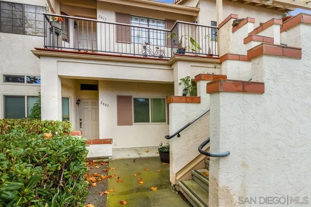 front view of a house with a small yard