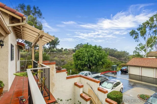 a view of balcony with furniture