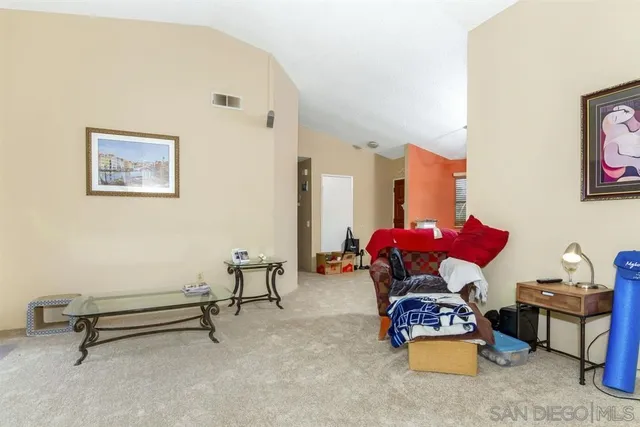 a living room with furniture and a table