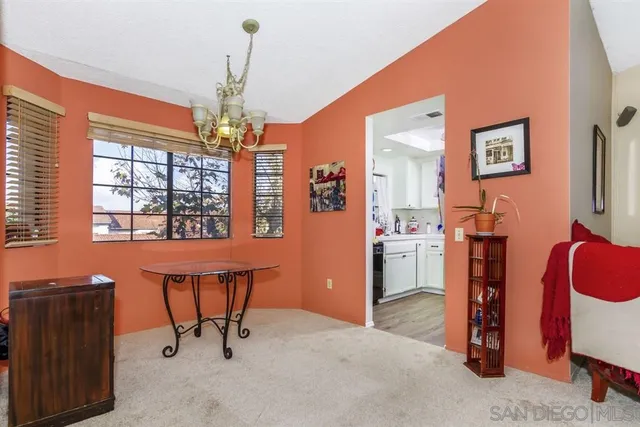 a view of a room with workspace and windows