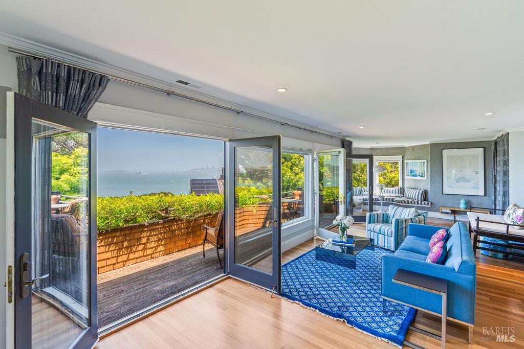 39 Cooper Lane Sausalito, CA 94965 - Photo 18 of 71 a living room with furniture and a floor to ceiling window