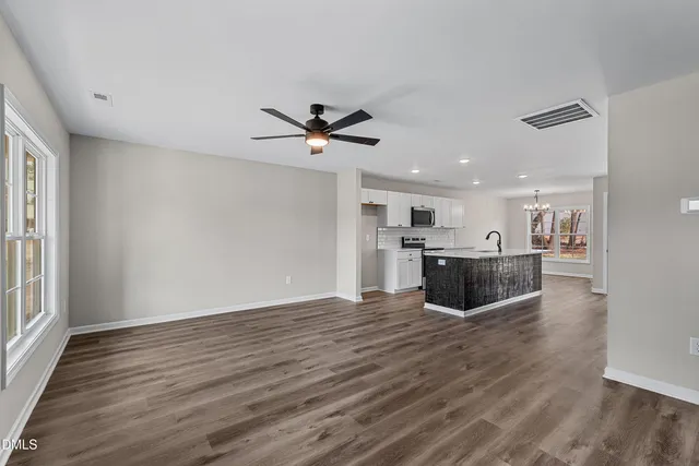 a view of a kitchen with microwave and cabinets