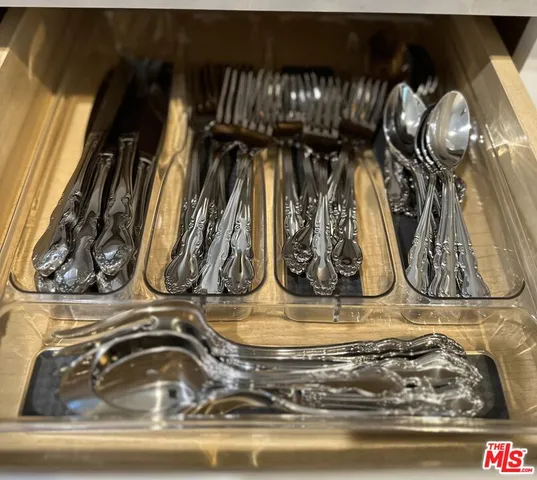 a living room with stainless steel appliances