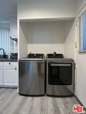 a kitchen with granite countertop a stove and a microwave