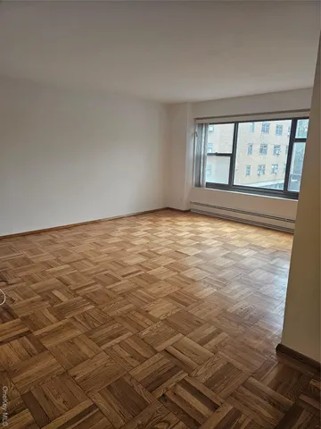 a view of an empty room with a window