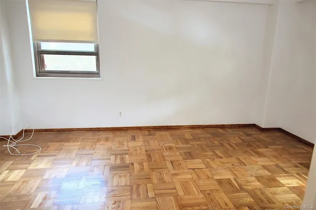 a white bath tub sitting next to a white sink and a toilet