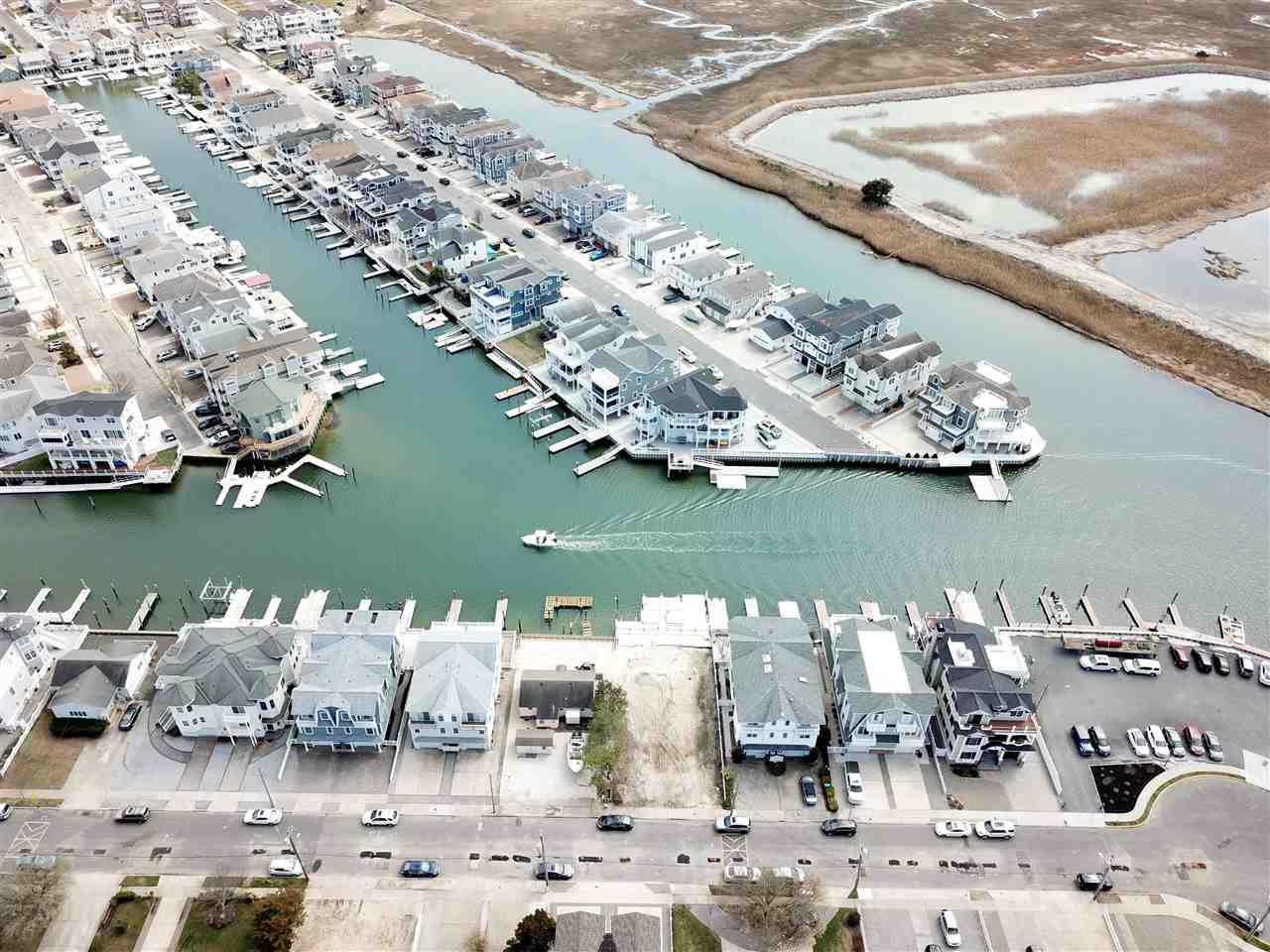 4471 Venicean Road, Unit NORTH Sea Isle City, NJ 08243 - Photo 5 of 14 a view of a lake with a mountain