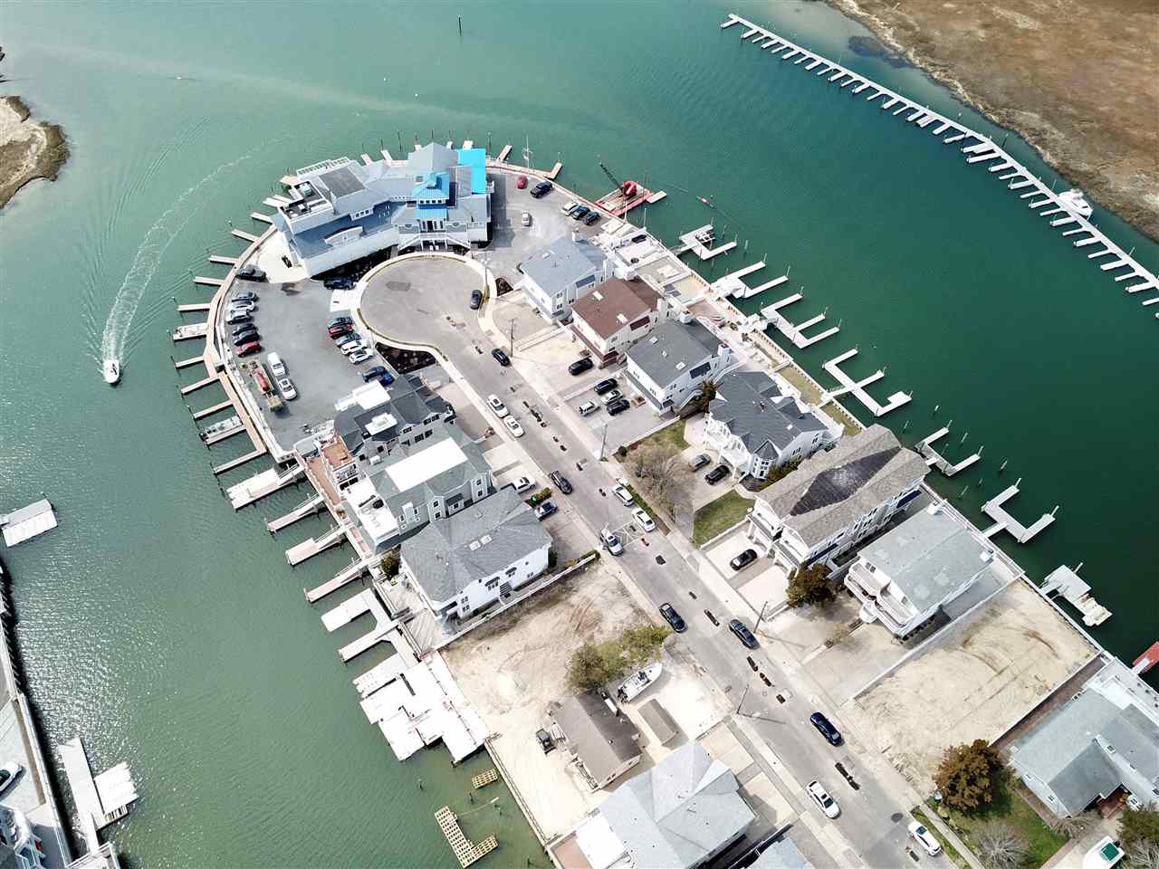 4471 Venicean Road, Unit NORTH Sea Isle City, NJ 08243 - Photo 6 of 14 an aerial view of a house pool ocean view