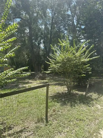 a view of swimming pool from a yard