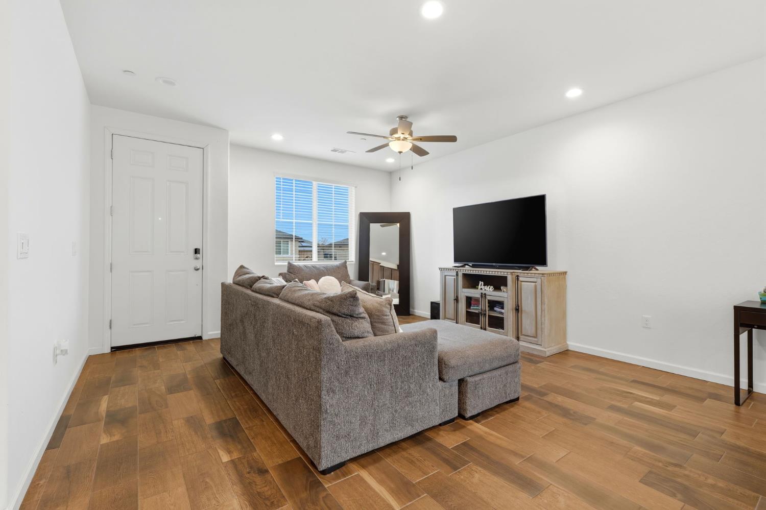 3125 Seymour Street Tulare, CA 93274 - Photo 12 of 52 a living room with furniture and a flat screen tv