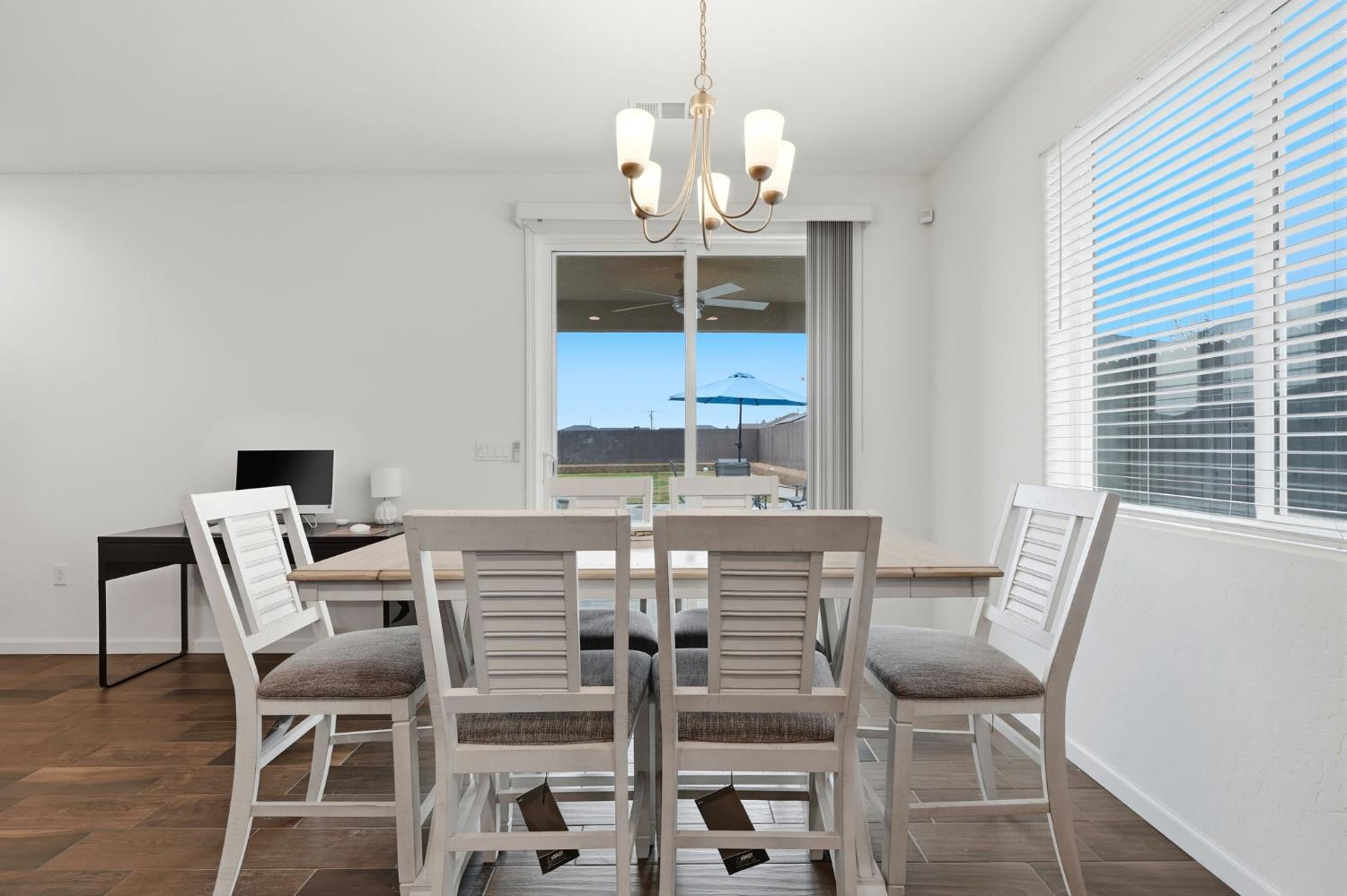 3125 Seymour Street Tulare, CA 93274 - Photo 24 of 52 a view of a dining room with furniture and chandelier