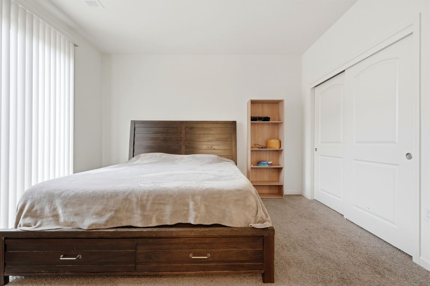 3125 Seymour Street Tulare, CA 93274 - Photo 27 of 52 a bedroom with a bed and a window