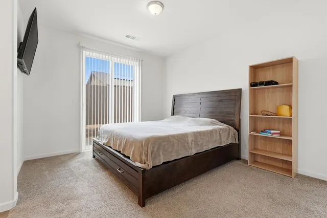 a large white bed in a white room