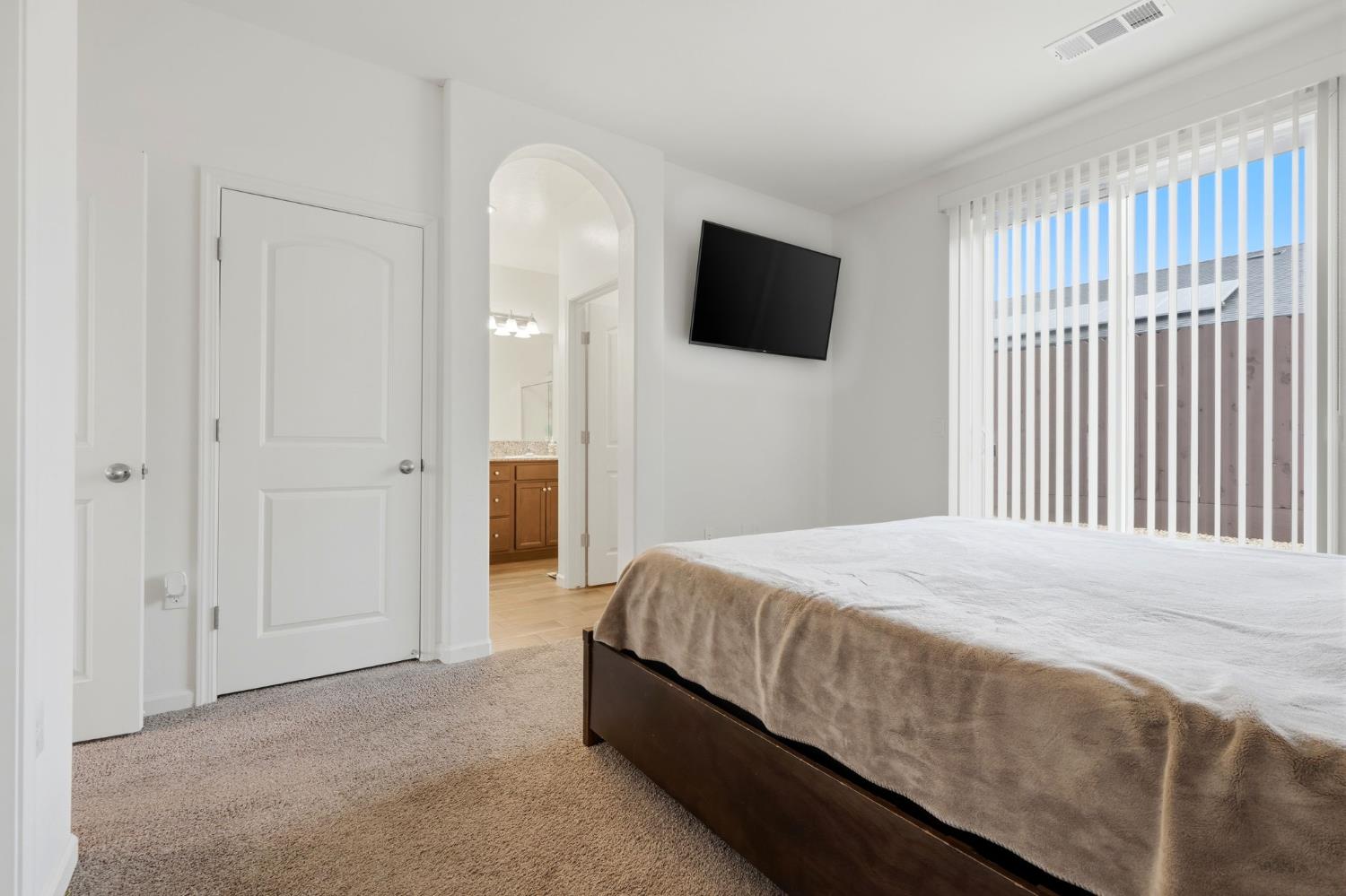 3125 Seymour Street Tulare, CA 93274 - Photo 31 of 52 a bedroom with a bed and a television