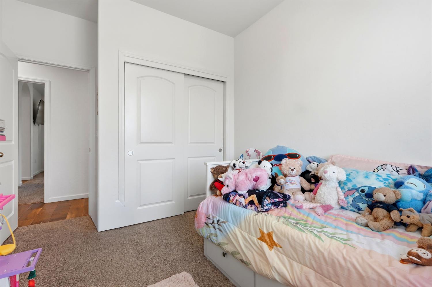 3125 Seymour Street Tulare, CA 93274 - Photo 34 of 52 a bedroom with a bed and a potted plant