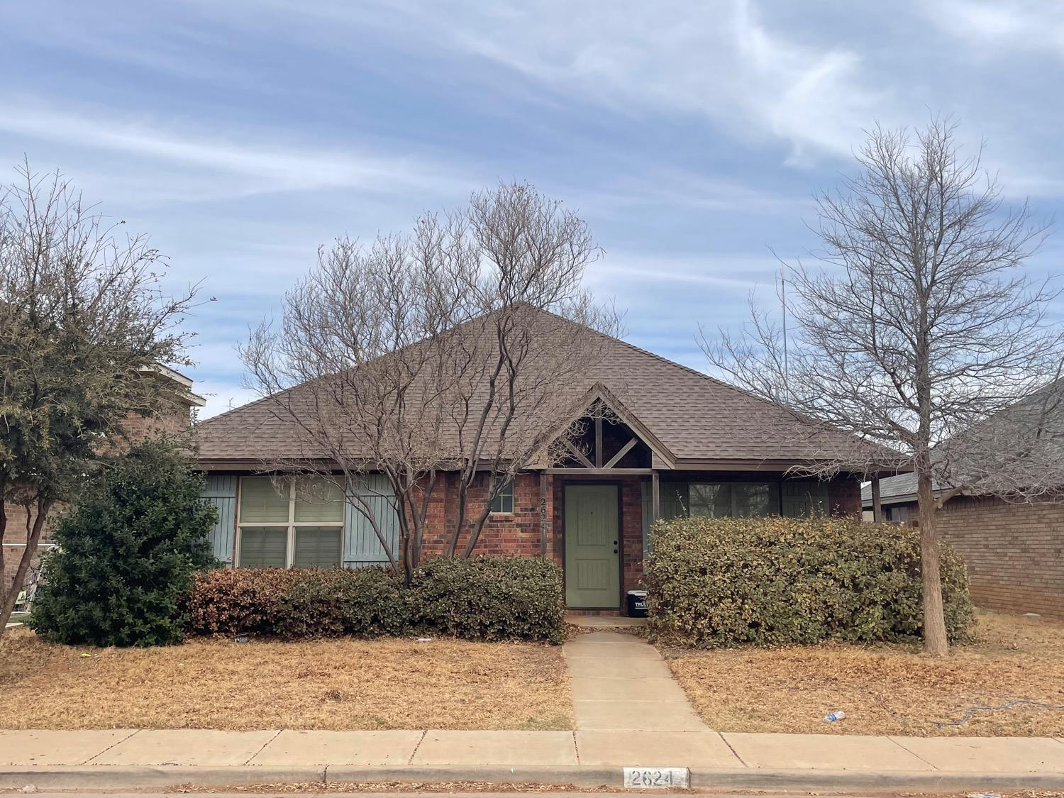 2624 112th Street Lubbock, TX 79423 - Photo 2 of 12 a front view of a house with a yard