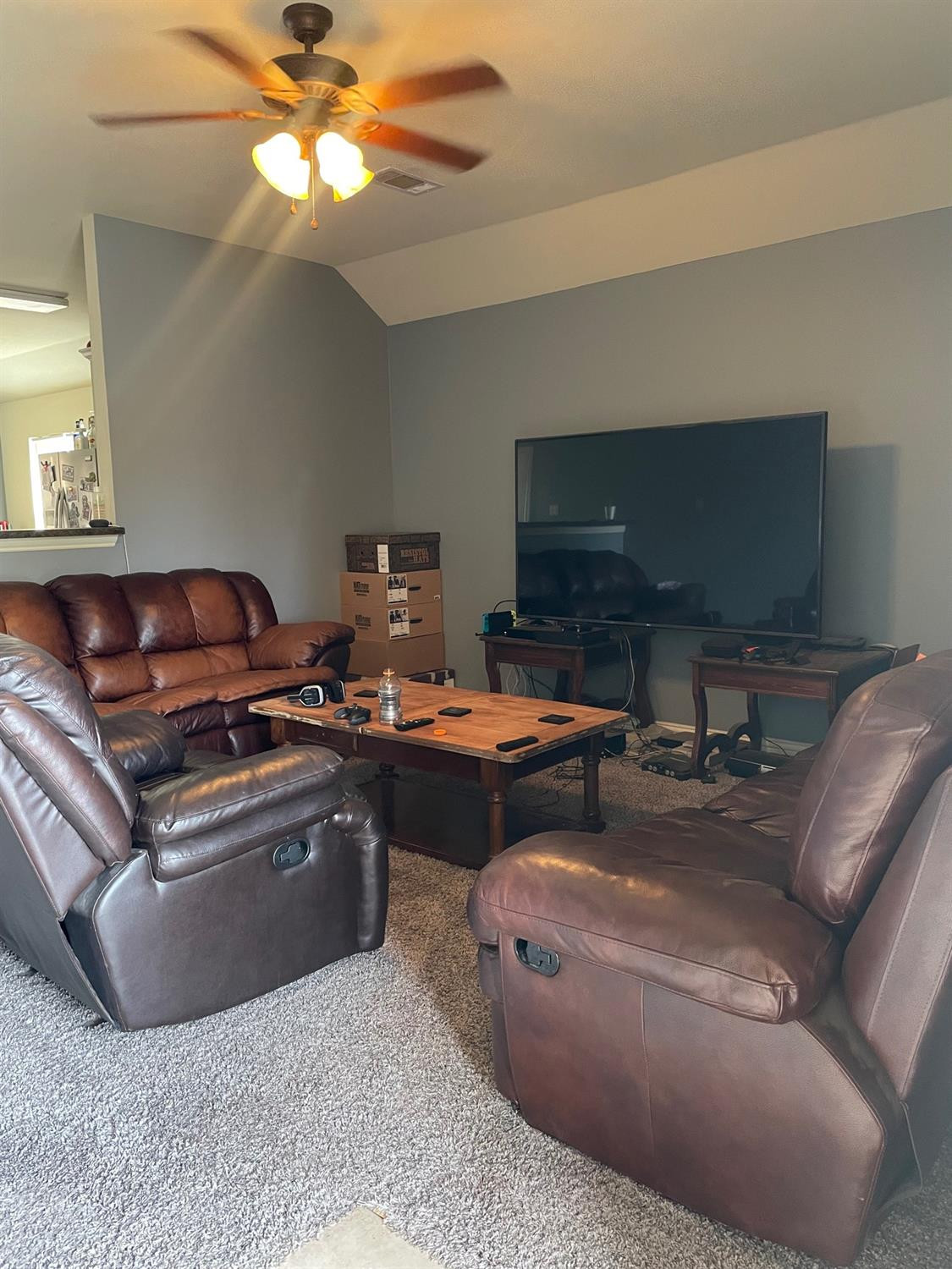 2624 112th Street Lubbock, TX 79423 - Photo 4 of 12 a living room with furniture and a flat screen tv