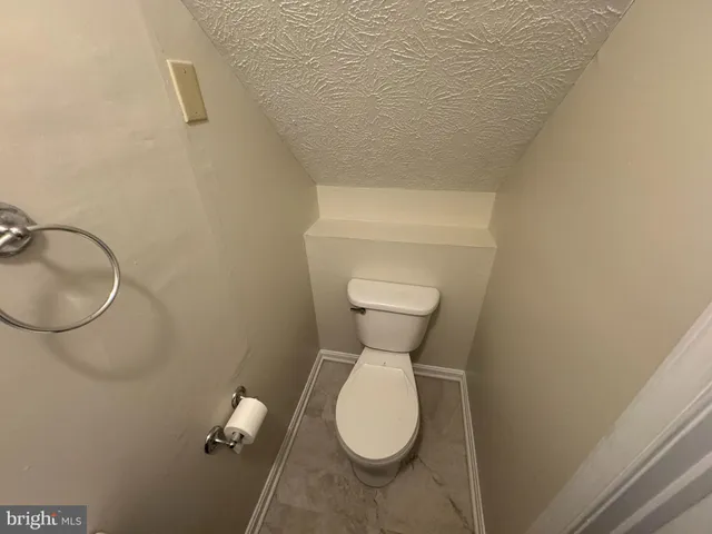 a bathroom with a toilet and sink