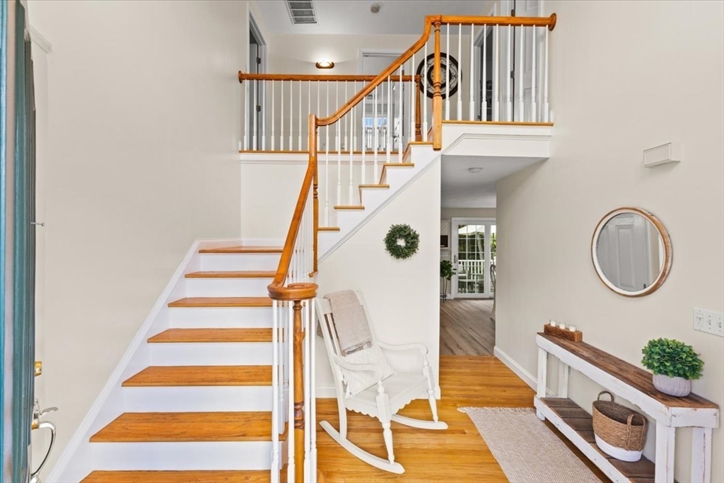 125 Independence Avenue Hanson, MA 02341 - Photo 14 of 42 a view of entryway and hall with wooden floor