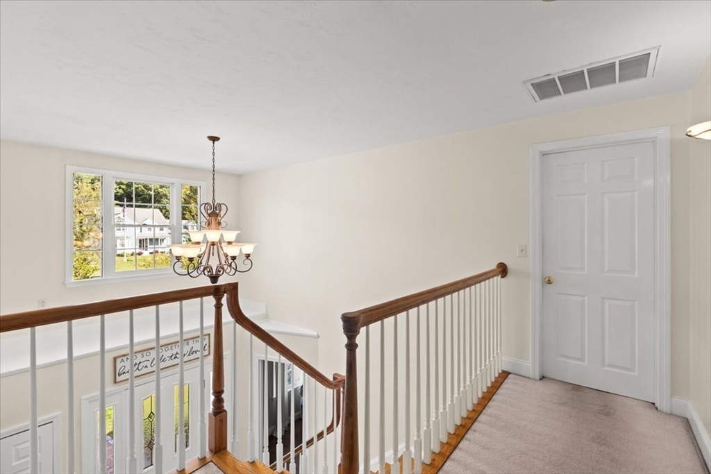 125 Independence Avenue Hanson, MA 02341 - Photo 15 of 42 a view of a hallway with a dining space