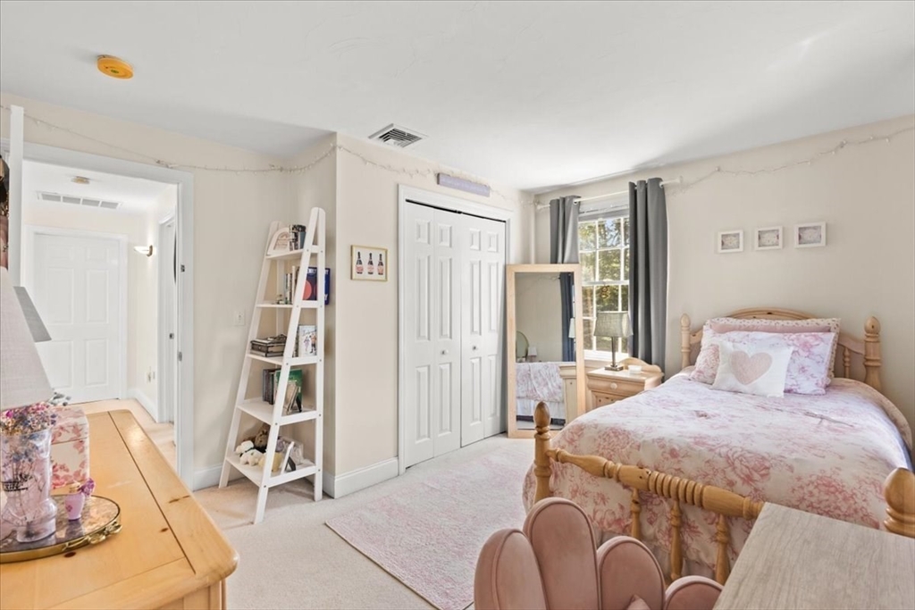 125 Independence Avenue Hanson, MA 02341 - Photo 19 of 42 a bedroom with a bed next to a window