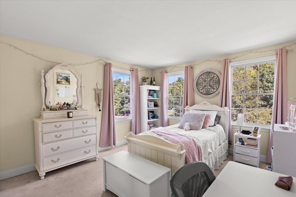 125 Independence Avenue Hanson, MA 02341 - Photo 20 of 42 a bedroom with a bed a mirror and a window