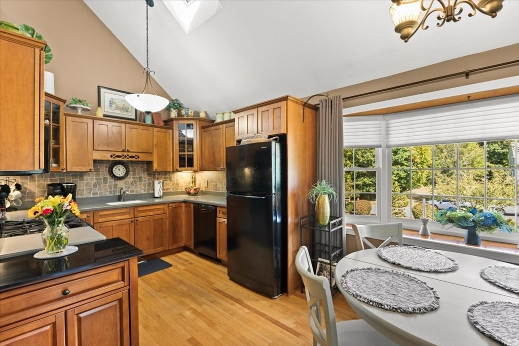 125 Independence Avenue Hanson, MA 02341 - Photo 25 of 42 a kitchen with refrigerator and window
