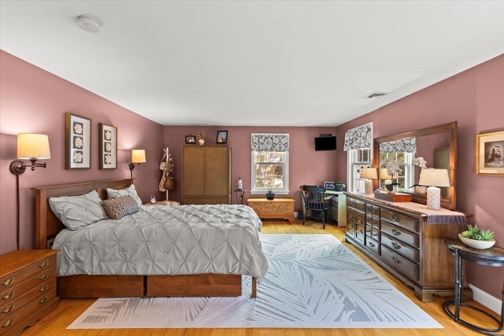 125 Independence Avenue Hanson, MA 02341 - Photo 29 of 42 a bedroom with a large bed and a couch