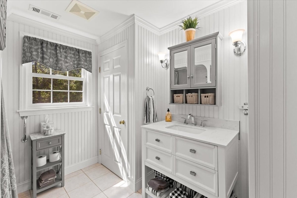 125 Independence Avenue Hanson, MA 02341 - Photo 30 of 42 a bathroom with a sink vanity and a mirror
