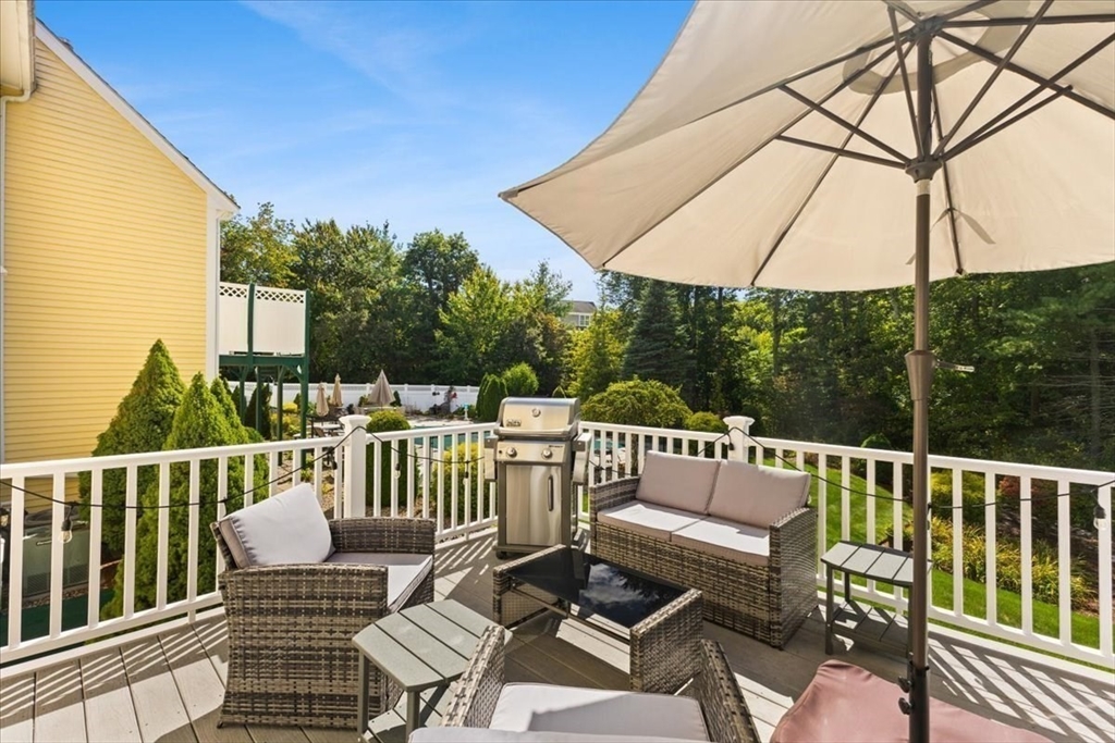 125 Independence Avenue Hanson, MA 02341 - Photo 33 of 42 a view of a chair and table in the balcony