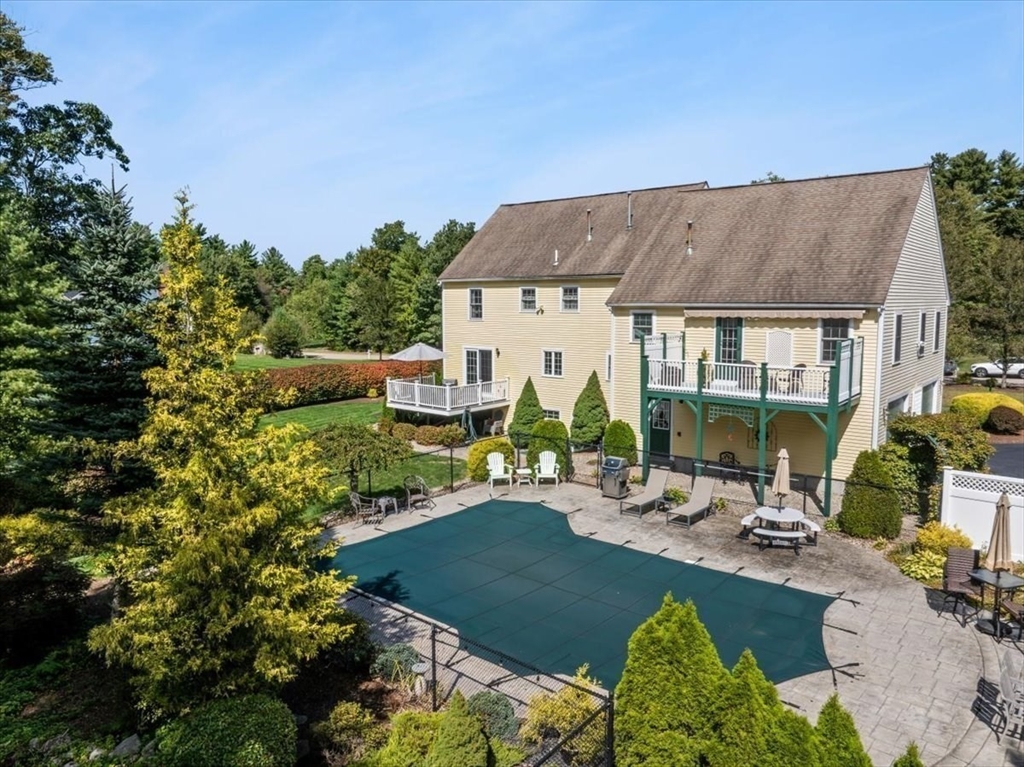 125 Independence Avenue Hanson, MA 02341 - Photo 34 of 42 a view of a house with backyard outdoor seating area and swimming pool