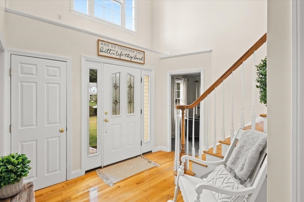 125 Independence Avenue Hanson, MA 02341 - Photo 4 of 42 a view of a hallway with furniture and staircase