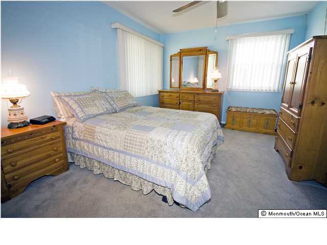 14 Masters Road Brick, NJ 08724 - Photo 3 of 3 a living room with a bed furniture and a window