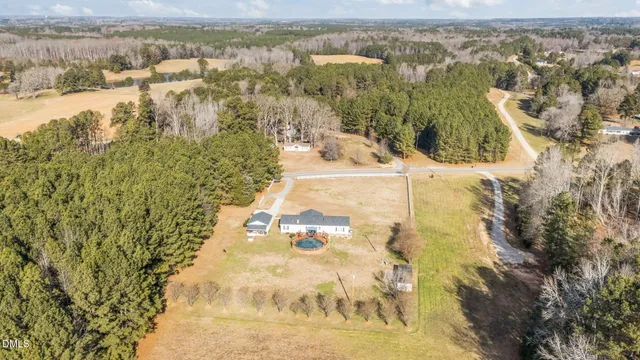 a kitchen with stainless steel appliances granite countertop a sink a stove cabinets and wooden floor