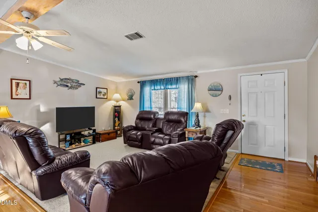 a white bath tub sitting in a bathroom next to a window