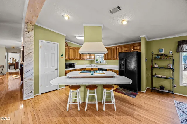 a bedroom with furniture and a flat screen tv