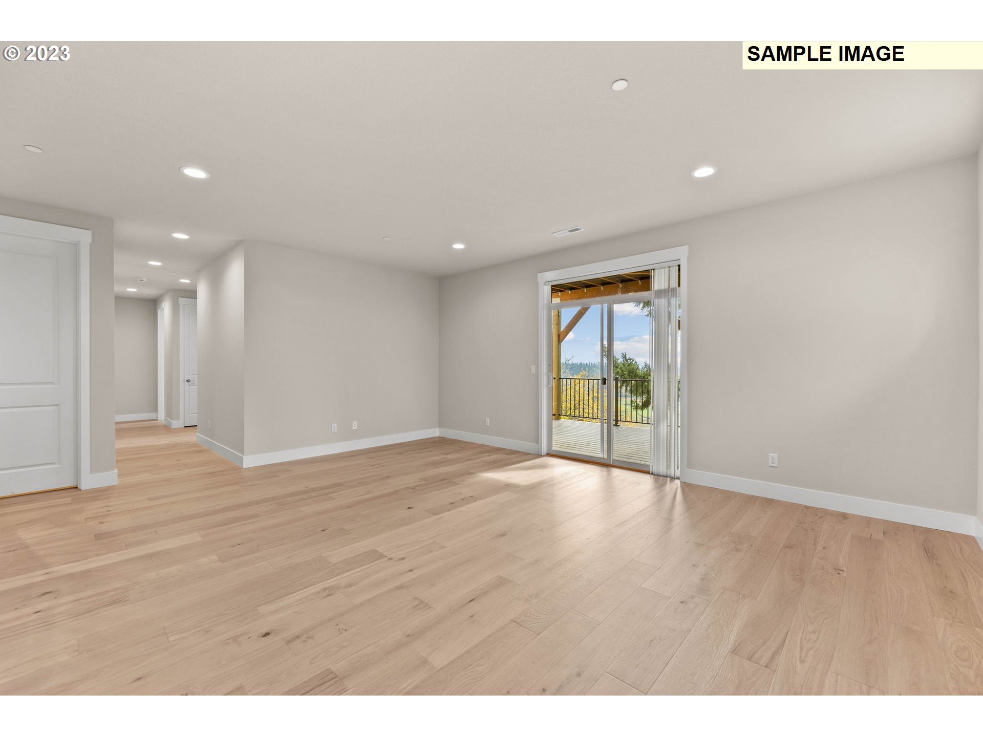 5482 North 94th Avenue, Unit LT213 Camas, WA 98607 - Photo 20 of 39 a view of an empty room with wooden floor and a window