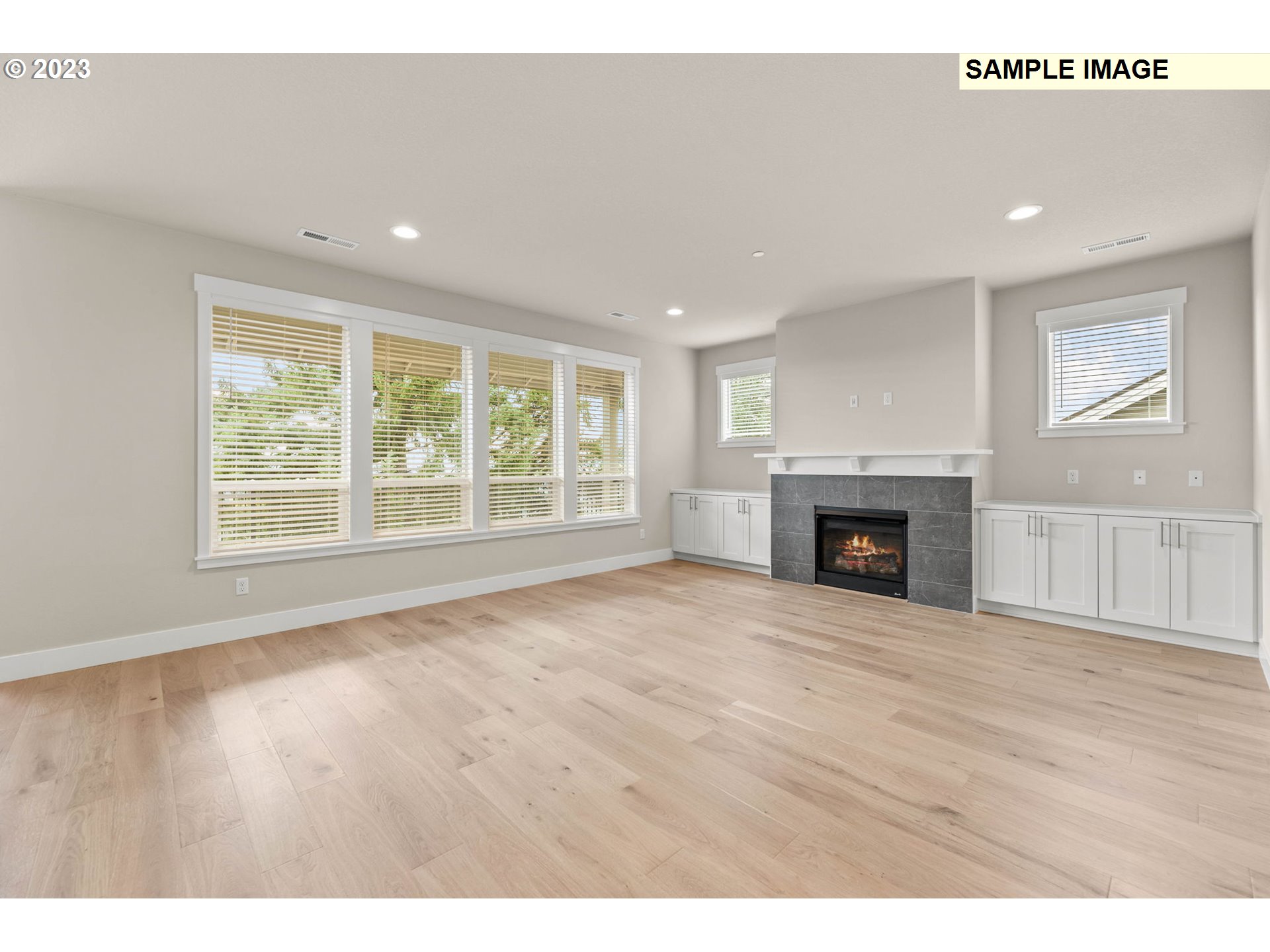 5482 North 94th Avenue, Unit LT213 Camas, WA 98607 - Photo 29 of 39 a view of empty room with wooden floor and fireplace