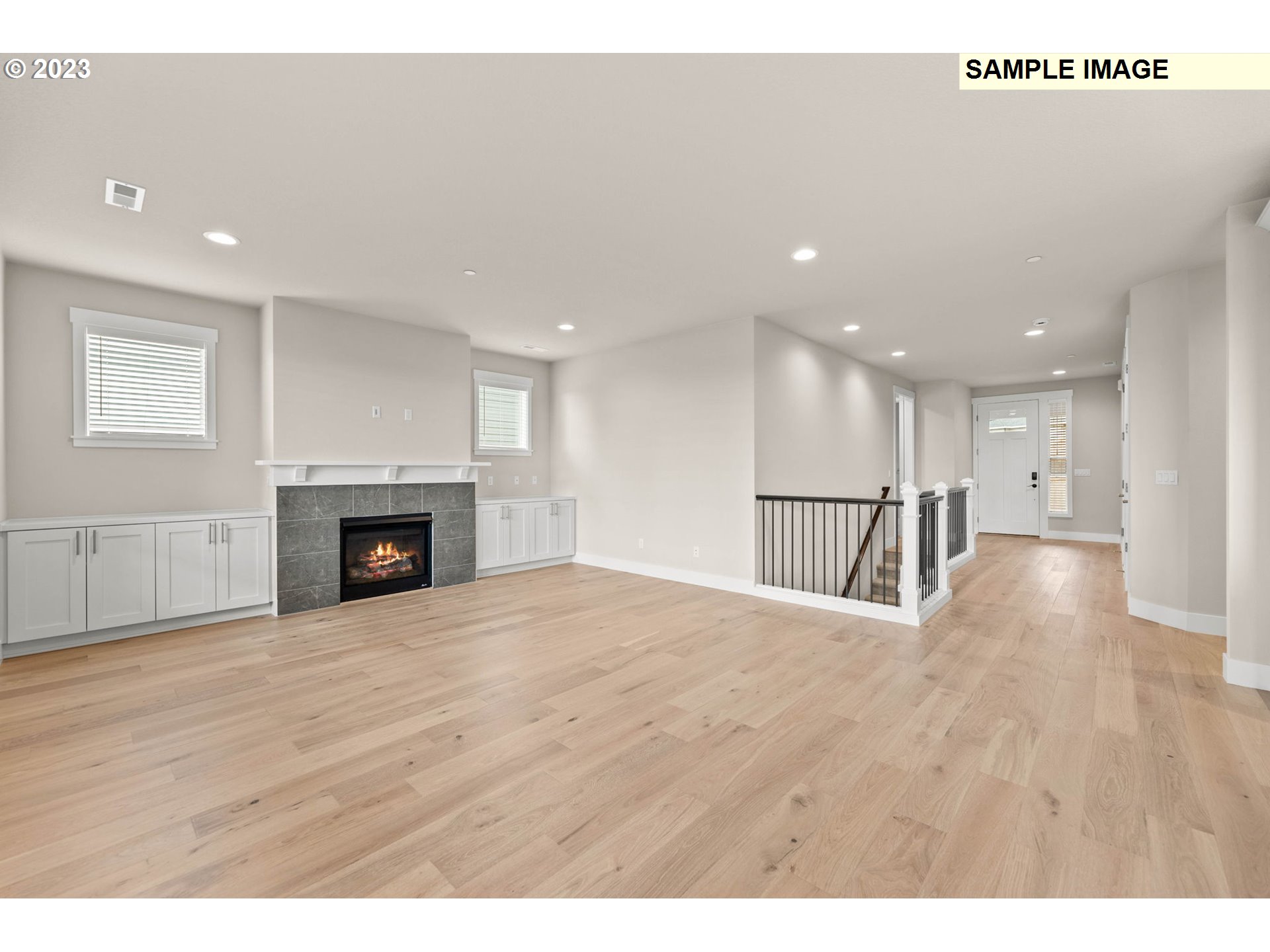 5482 North 94th Avenue, Unit LT213 Camas, WA 98607 - Photo 30 of 39 a view of an empty room with wooden floor and a fireplace