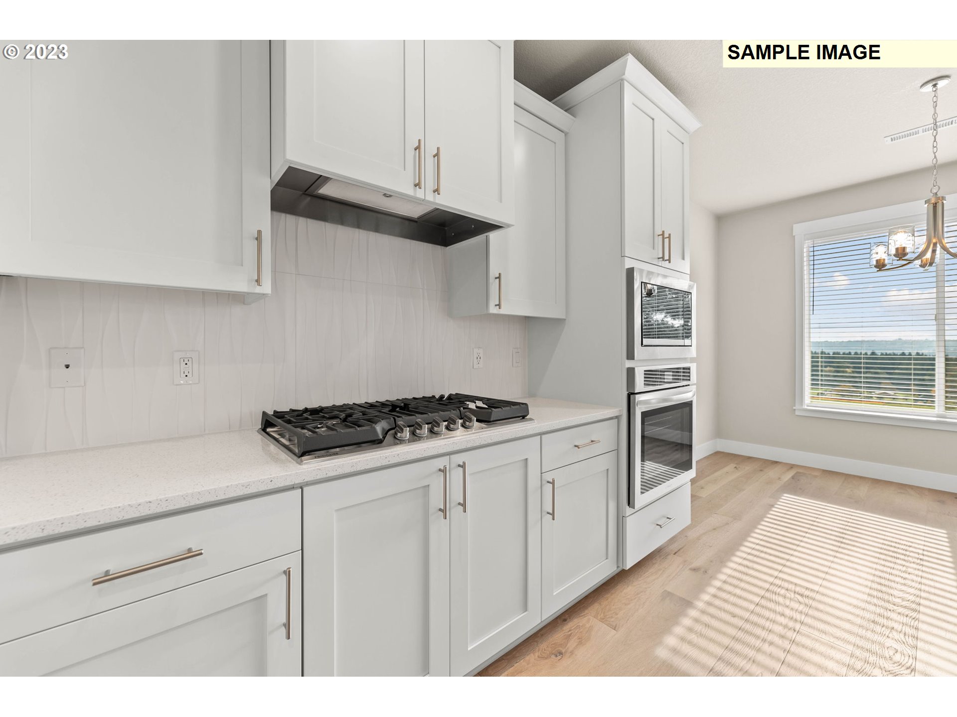 5482 North 94th Avenue, Unit LT213 Camas, WA 98607 - Photo 3 of 39 a kitchen with granite countertop a stove and a wooden cabinets