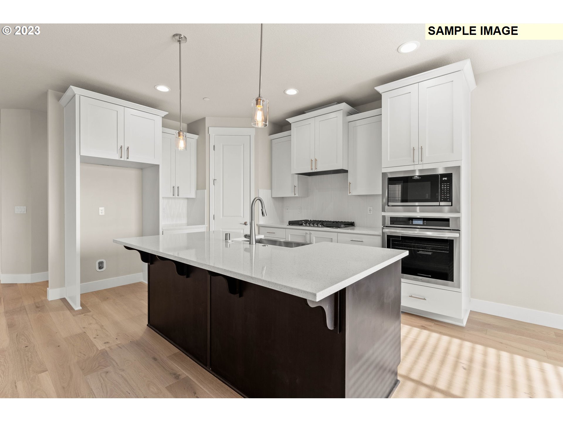 5482 North 94th Avenue, Unit LT213 Camas, WA 98607 - Photo 6 of 39 a kitchen with kitchen island a sink stainless steel appliances and cabinets
