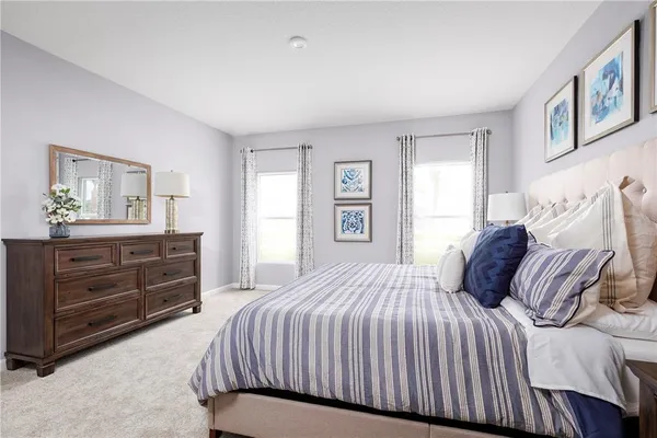 a bedroom with a bed and a dresser