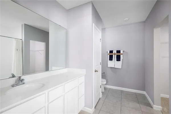 a bathroom with a bathtub and a sink