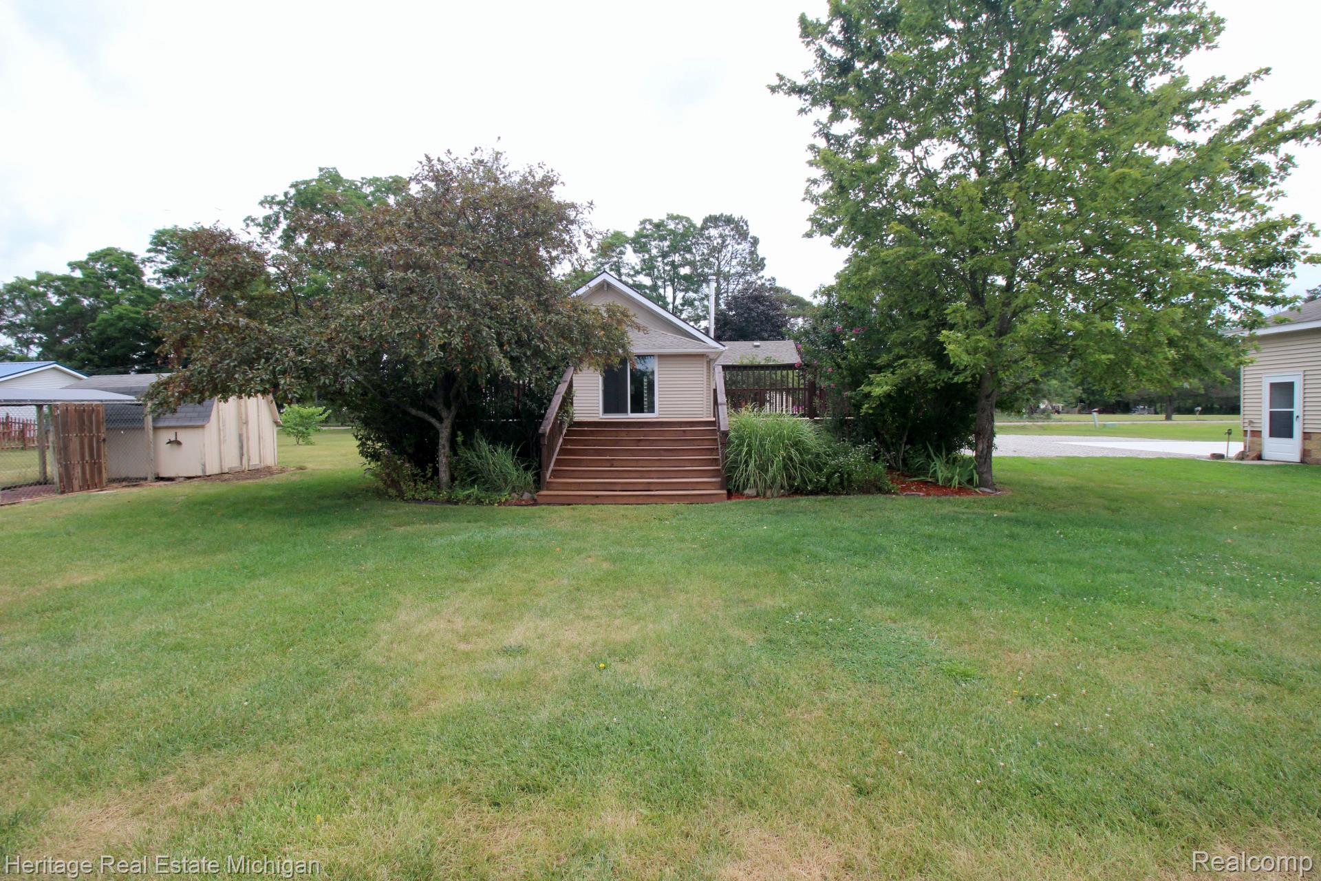 15352 South Duffield Road Byron, MI 48418 - Photo 34 of 47 Expansive green lawn providing a generous outdoor area