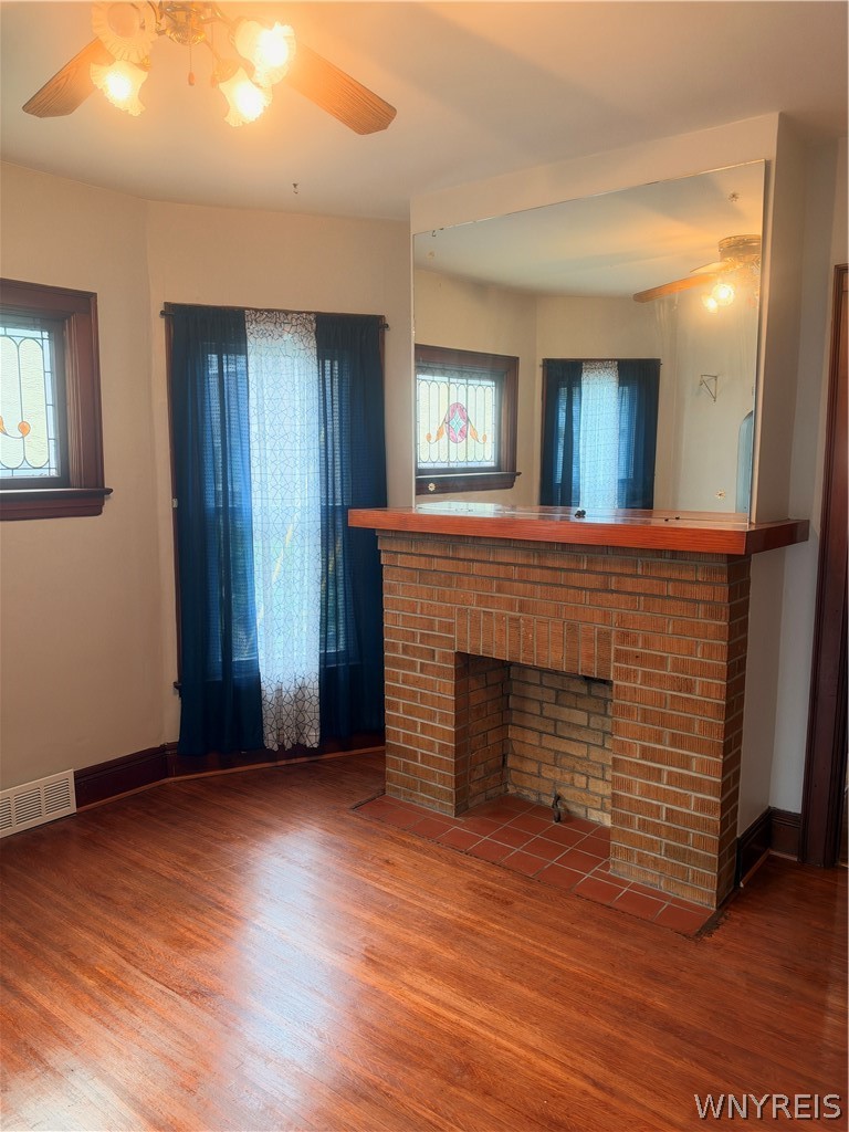 166 Herkimer Street Buffalo, NY 14213 - Photo 7 of 13 Rich hardwood flooring complements a classic brick