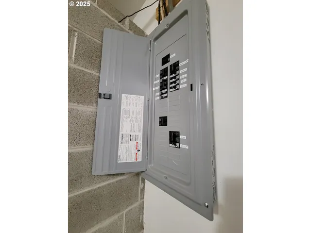 a bathroom with a shower and mirror