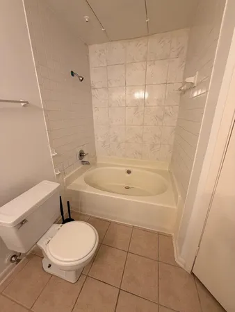 a bathroom with a bathtub and toilet