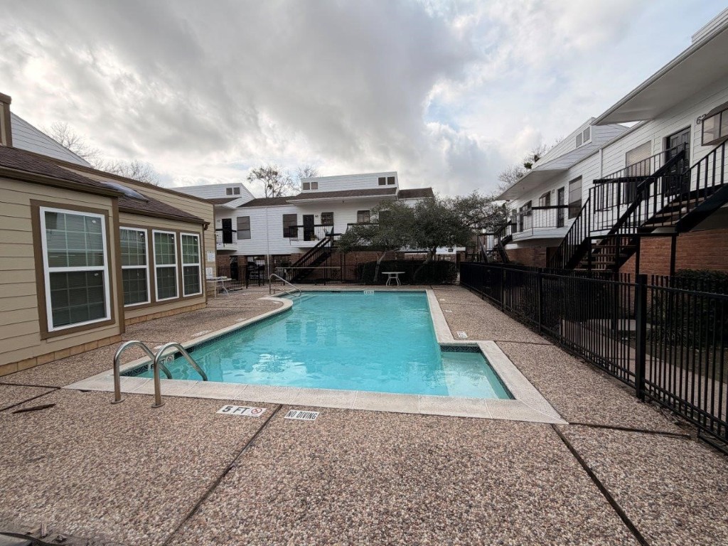 7901 Cambridge Street, Unit 25 Houston, TX 77054 - Photo 14 of 18 a view of a house with backyard and sitting area